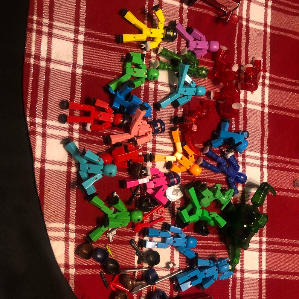 Assorted stick bots . Includes stick bots pets , filming tripods, and weapons